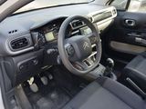 the interior of a small car with a steering wheel and dashboard