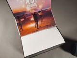 a book that is sitting on a table with a mouse