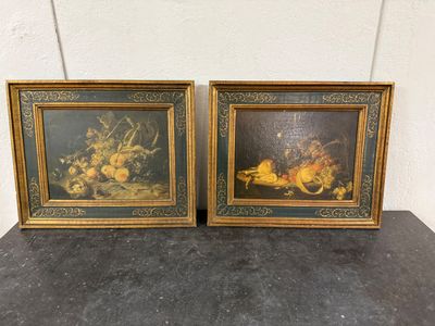 two framed paintings of fruit and flowers on a table