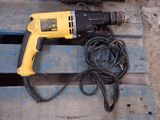a drill and a cord on a pallet
