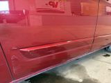 a red car that is parked in a garage