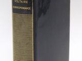 a close up of a book on a white surface