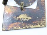 a picture of a metal object on a white surface