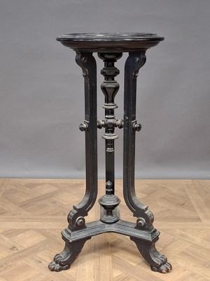 an image of a black table on top of a wooden floor