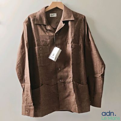 an image of a brown jacket hanging on a hanger