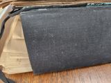 an old book sitting on top of a wooden table