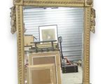 a mirror that is sitting on the wall next to a pile of boxes