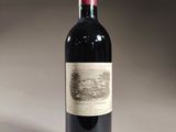 a bottle of wine that is sitting on a table
