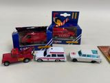 four toy cars that are sitting next to each other