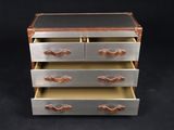 an image of a chest of drawers with leather handles