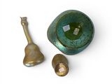 a small bowl and a spoon sitting next to each other