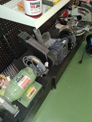 a man that is working on a machine in a shop