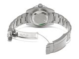 an image of a wrist watch with a green bezel on it