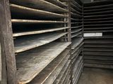a lot of shelves that are stacked up in a room
