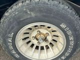 a tire that is sitting on the side of the road
