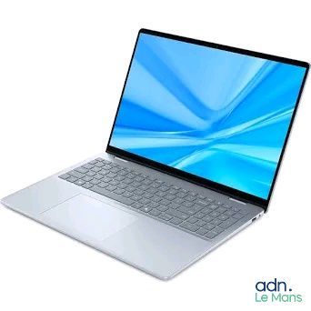 l'image d'un ordinateur portable posé sur une surface blanche