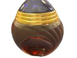 an image of a bottle of perfume sitting on a white surface