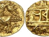 a gold coin with an image of a bird on it