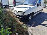 a white van that is parked on the side of the road