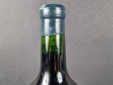 a bottle of wine that is sitting on a table
