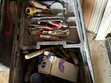 a tool box full of tools sitting on the floor