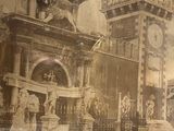 an old photo of a large building with a clock tower