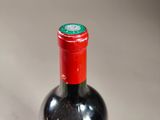 a bottle of wine that is sitting on a table