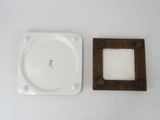 a picture of a plate and a picture frame on a table