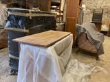 a lot of furniture that is being moved in the room