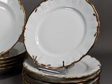 many plates stacked on top of each other on a table