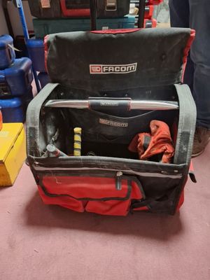 two pieces of luggage sitting on top of each other in a room