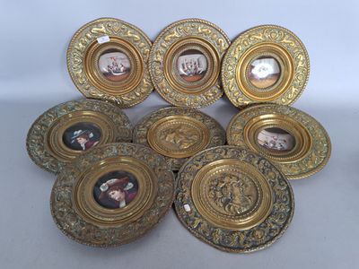 six gold plated picture frames with pictures of people on them