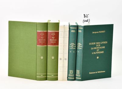 three books sitting next to each other on a white surface