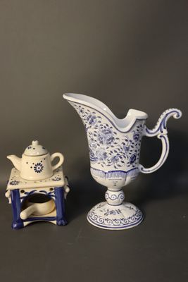 a small blue and white pitcher and a small blue and white teapot