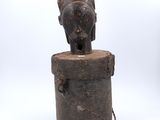 a close up of a statue of an elephant on top of a wooden box