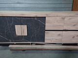 a picture of a wooden cabinet with a black marble top