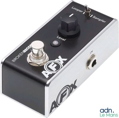 a close up of a black and silver guitar pedal overdriver