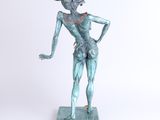 statue of a man with a hat on his head and hands on his hips