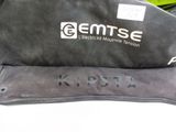 a black bag with a name on it sitting on a table