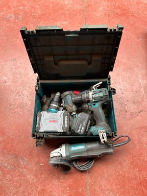 a tool box full of power tools on the floor