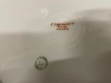 a close up of a plate with a logo on it