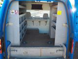a blue van that has the door open and the back door open