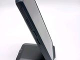 a cell phone that is sitting on top of a stand