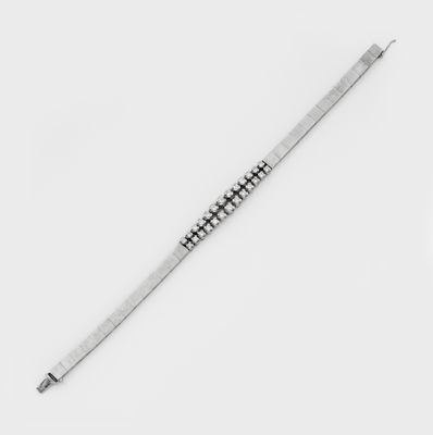 black and white photograph of a knife on a white surface