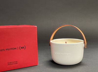 an image of a white candle with a red box in the background