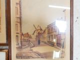 une photo d'un tableau accroché au mur