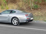 a silver sports car parked on the side of the road