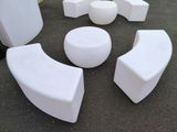 a lot of white furniture that is on the ground