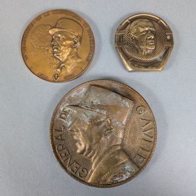 three different types of coins are shown on a white surface