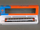 a box with a train car in it sitting on a table